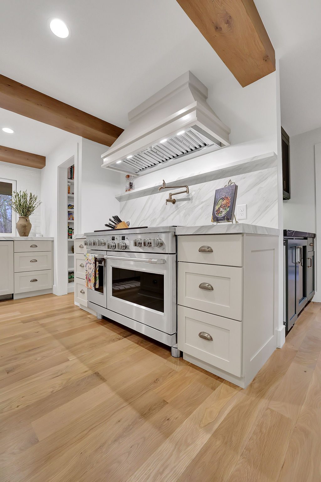 Kitchen with floating shelves and full-height slab