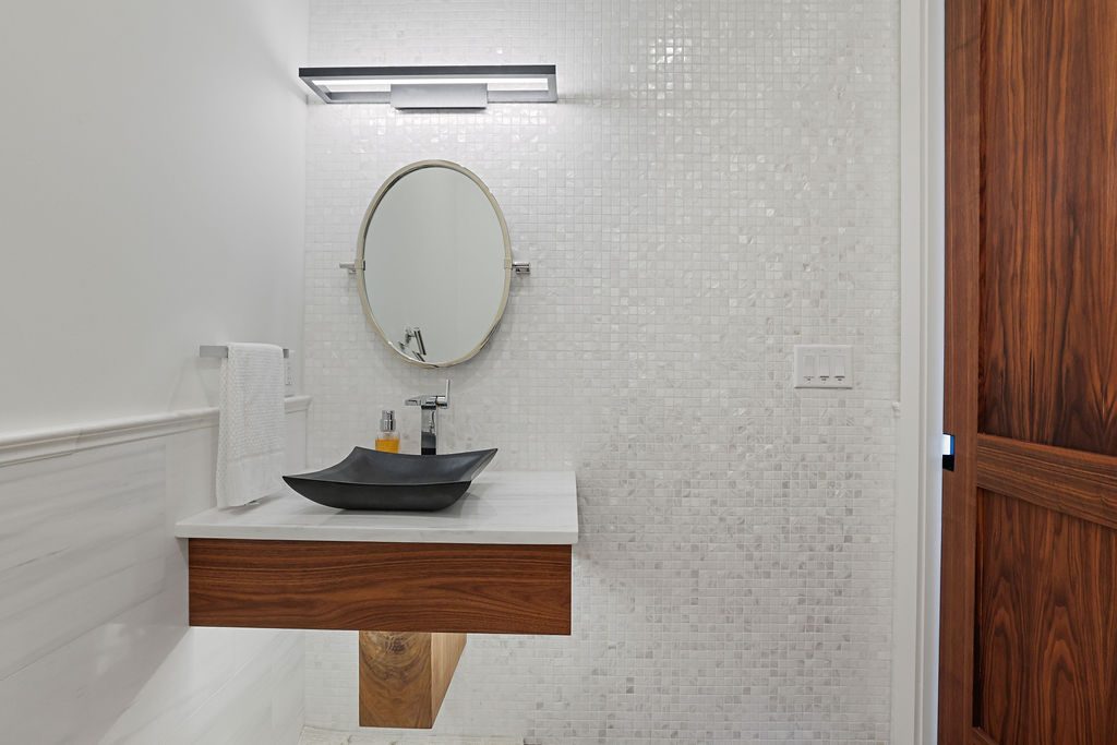 Powder Room — Mosaic tile & floating vanity
